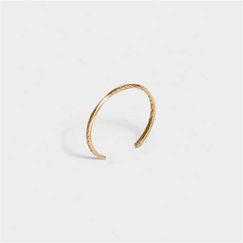 Celine Animals twisted bracelet in brass with vintage gold finish